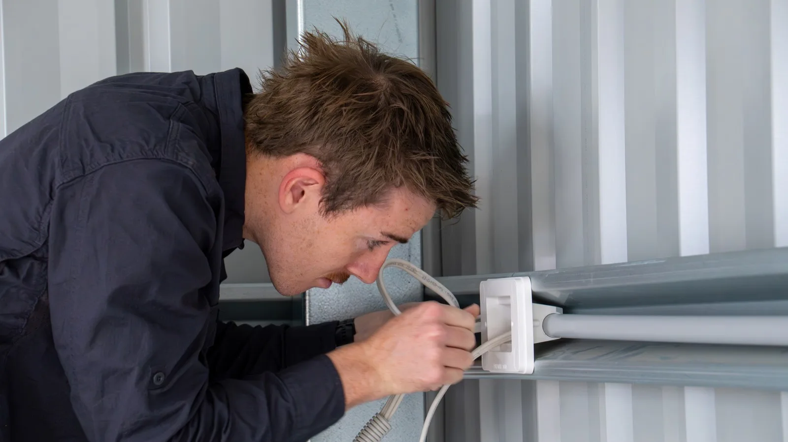 AMPY electrician working on an electrical installation