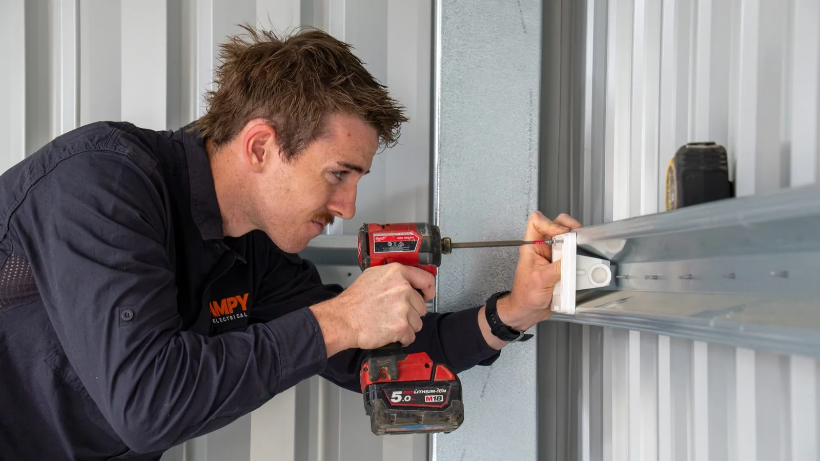 AMPY electrician working on an electrical installation